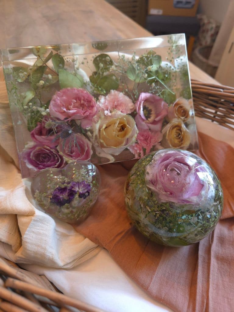 Floral preservation large sphere preserving flowers such as pink roses, thistles, white roses, sea thrift, and greenery. Book now to preserve your special wedding keepsake or special occasion heirloom now!