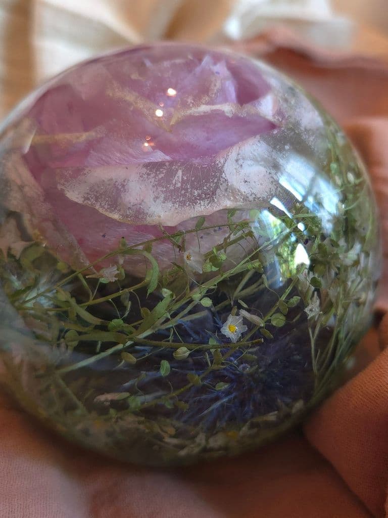 Floral preservation large sphere preserving flowers such as pink roses, thistles, white roses, sea thrift, and greenery. Book now to preserve your special wedding keepsake or special occasion heirloom now!