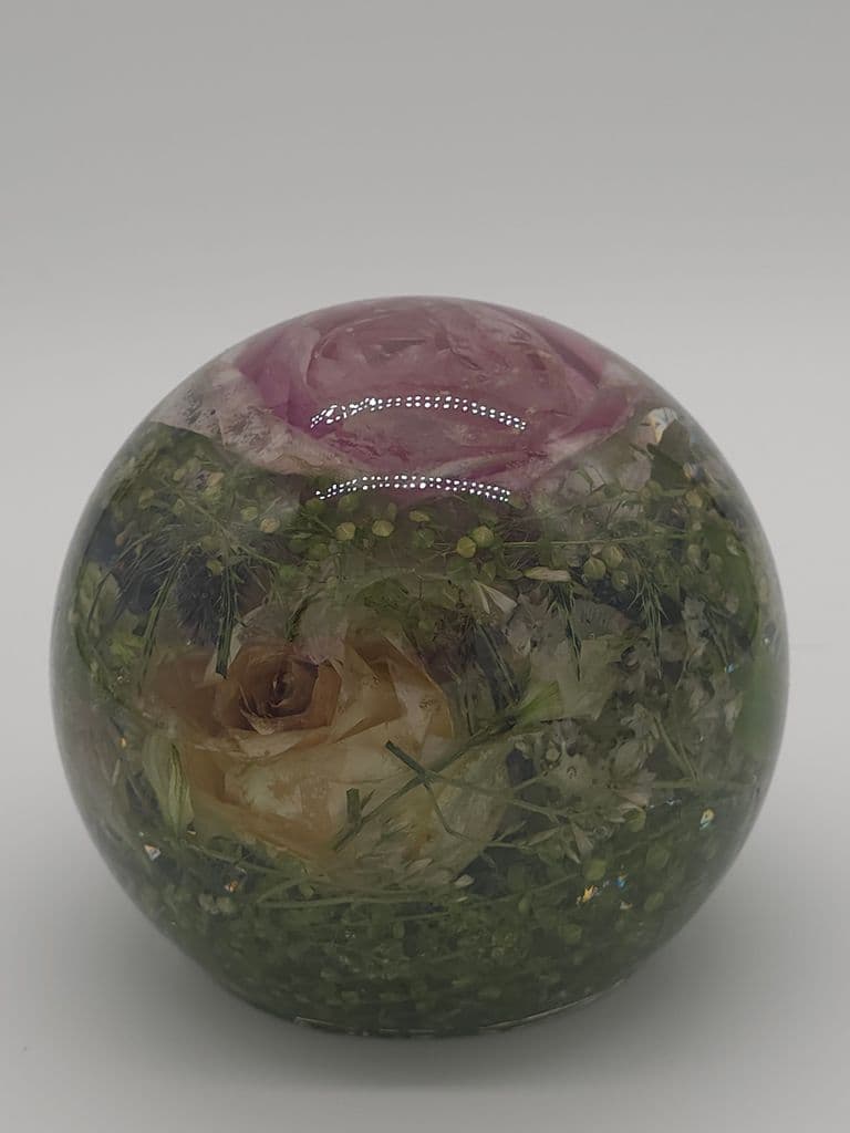 Floral preservation large sphere preserving flowers such as pink roses, thistles, white roses, sea thrift, and greenery. Book now to preserve your special wedding keepsake or special occasion heirloom now!